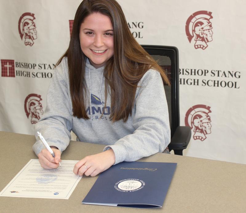 Dartmouth, MA news - sports - Bishop Stang senior Julia Chausse signing the letter of intent. Photo courtesy: Bishop Stang